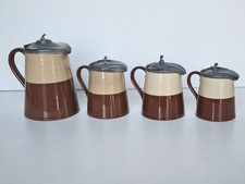 4 pots à lait en faïence couvercles en étains époque début 20ème à identifier.