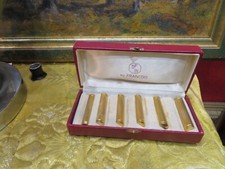 anciens porte couteau en bronze doré epoque 1980 par francois hj paris ecrin