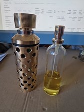  Eau de toilette  entamé de moitié  + son flacon d'habillage