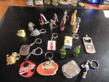 LOT 21 PORTE CLES BOISSON PERNOD ST RAPHAEL COURVOISIER CHAMPAGNE PERRIER BERGER