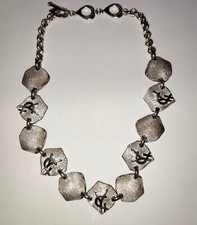 Collier  Sautoir Yves Saint Laurent  Métal de couleur Argenté YSL Haute Couture