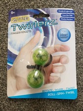 Jouet astuce gadget à doigts paillettes Twirlerz
