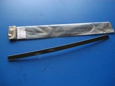 Enjoliveur latéral de lunette