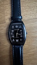 Montre avec chiffres en caractères  chinois - à quartz - noire