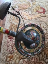 Jouet ancien en tôle roulette