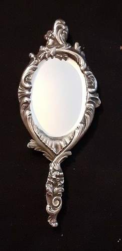Miroir face main pour - face,