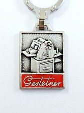 PORTE-CLES - GESTETNER 1960s - IMPRIMEURS Vintage AUGIS Métal ÉMAILLÉ Imprimerie