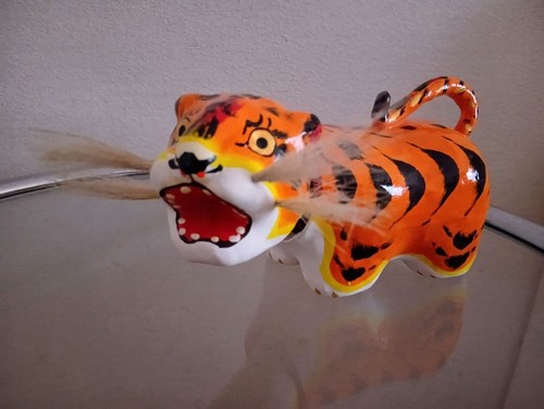 Tête oscillante tigre en - oscillante,