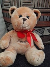 OF / DOUDOU PELUCHE OURS LINDT COEUR ROUGE NOEUD SATIN 27CM ASSIS TTBE