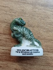 (F1) Fève feve Série Dinosaure VELOCIRAPTOR universal studios TM