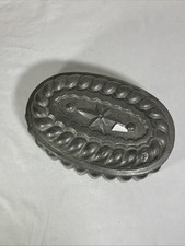 Moule à brioche en fer blanc