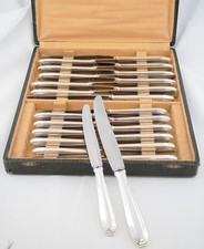 24 couteaux métal argenté