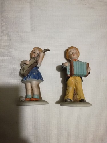 Couple figurines en - de,