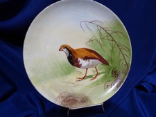 ASSIETTE ANCIENNE EN PORCELAINE DECORATIVE. OISEAU. SIGNEE LUC. FRANCE. REF 3331