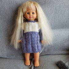 poupée  Falca avec grande mèche  qui fonctionne de 42 cm bonne état  général