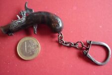 PORTE CLE PISTOLET /  " A AMORCE "