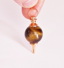 * PENDULE EN OEIL DE TIGRE