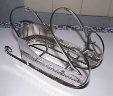 RARE ANCIEN PORTE BOUTEILLE EN METAL ARGENTE REPRESENTANT UN TRAINEAU ( noël ) 