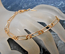 Bracelet maille figaro  or  18K  massif   poincon tete d aigle