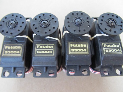 Four used futaba s3004 servos - four,