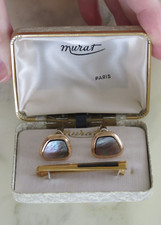 Elegante paire de boutons de