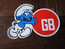PEYO -  autocollant publicitaire GB SCHTROUMPF POUSSE UNE BALLE ROUGE GB