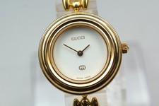 [Presque comme neuf] Montre-bracelet femme Gucci lunette changeante or...