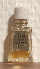 Rare. Extrait de Parfum Styx de Coty 2 ml. Étiquette dorée. Plein. Bon état 