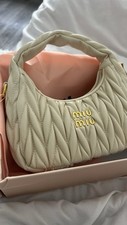 Sac à main miu miu couleur crème neuf sans emballage jamais porter