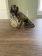 Ancien chien en bronze porte