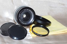 Objectif Pentax K 28mm f2,8 HOYA, bouchons, filtre 1A, pare-soleil et housse TBE