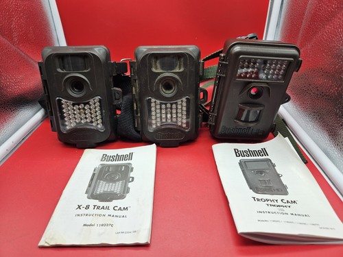 Three bushnell trail cameras - three,