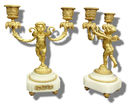Paire bougeoirs aux putti - aux,