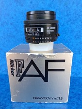 NIKON AF 1,8/50 mm.  Très bon état. Dans sa boite. Etat neuf.