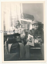 Vintage photo - little boy with magazine and mom in a bar by JUPITER juke box