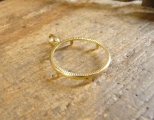 Monture porte pièce ciselé