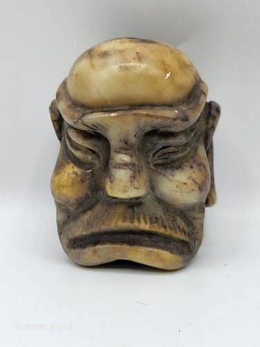 Sculpture tête asiatique
