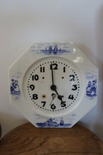 Pendule murale en faïence