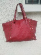 Sac à main Gérard Darel en cuir rouge clouté