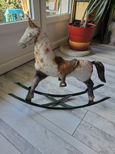 Ancien petit cheval à bascule en métal
