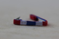 Fixe ruban rappel boutonnière