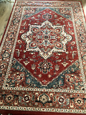 tapis d'orient en laine (mécanique) très bon état - 240 x 160 - ton rouge-orangé