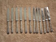 LOT 12 COUTEAUX / METAL ARGENTE-LAME NOGENT INOX (  LONGUEUR 20 CM )