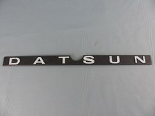 DATSUN sigle monogramme