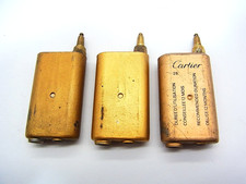 Lot de 3 briquets Cartier Gold