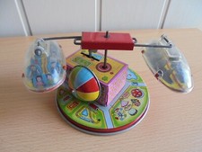 JOUET ANCIEN MECANIQUE AUTOMATE JAPAN MANEGE  EN TOLE A CLEF QUI FONCTIONNE 