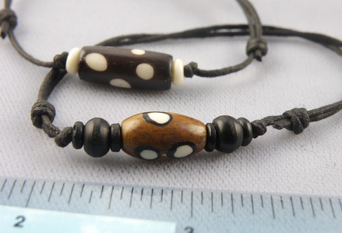 Tubular shape bone - beads, waxed