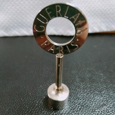 Porte photo " Guerlain " en acier inoxydable argenté neuf