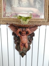 console ancienne en bois décor de chérubin polychrome sculpté