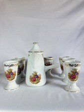 Service Chocolatière Et 8 mazagrans en Porcelaine.
